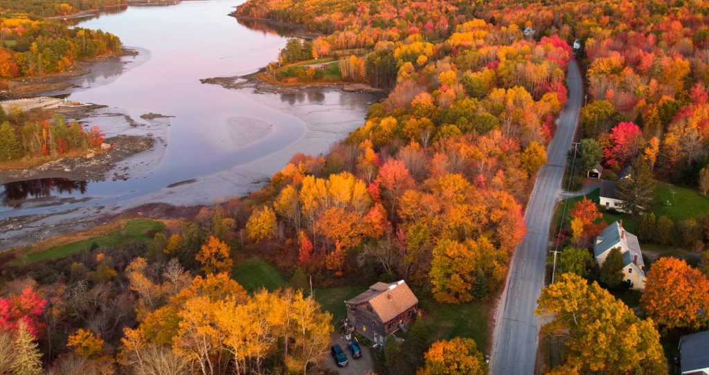 Maine in autumn cabin or home on a lake